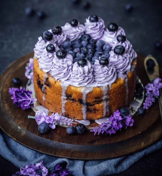 Lavender Berry Cream Cake Soft vanilla sponge layered with lavender-infused cream and wild berries. Each bite hums with soothing magic, said to calm restless hearts and inspire sweet dreams under moonlight.