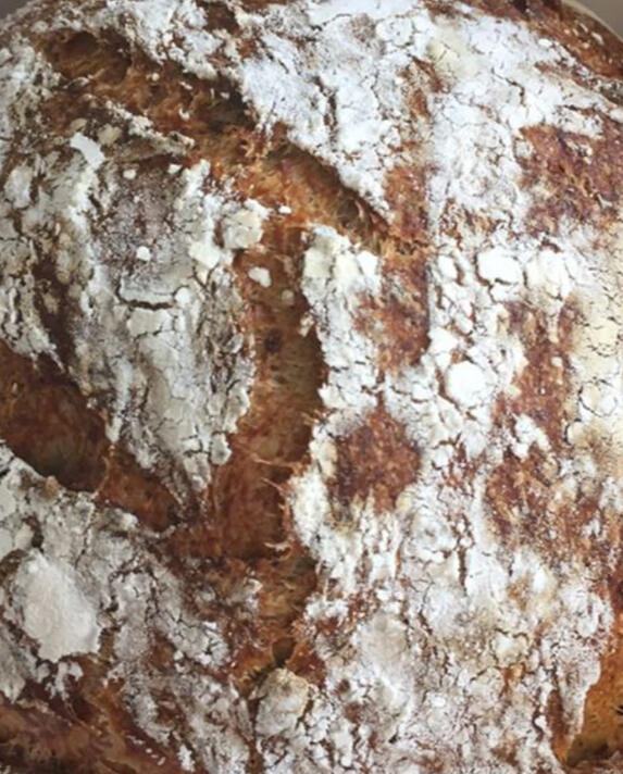 Hearth Bread A round, pull-apart loaf infused with garlic, rosemary, bits of meat, and black sea salt, served warm and smoky.