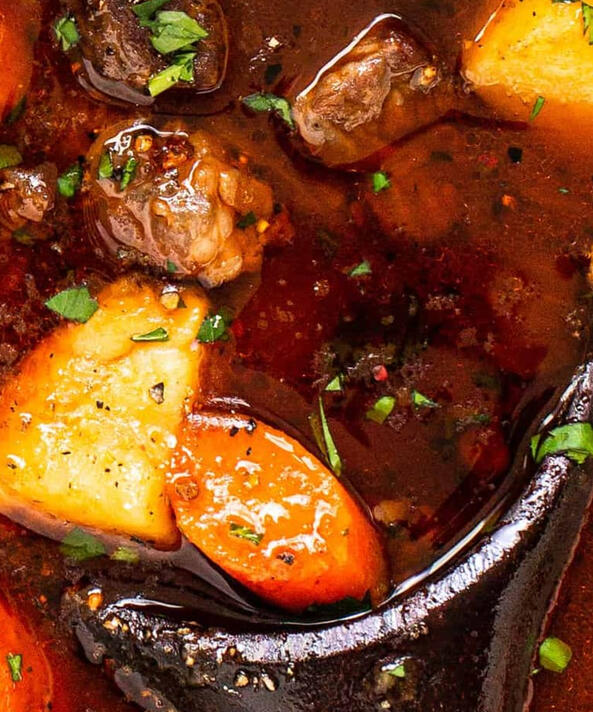 Starlight Stew A rich, hearty broth simmered with root vegetables, tender cuts of meat, and a sprinkle of glowing herbs said to ward off bad dreams.