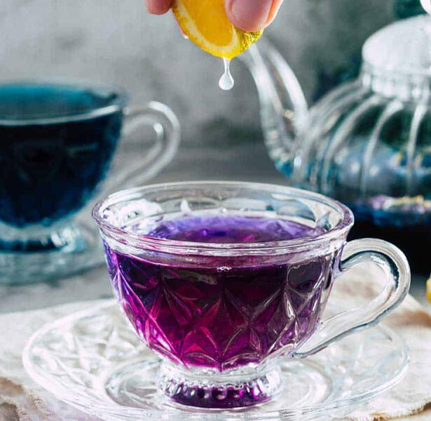 Dreamveil Elixir Blue butterfly pea flower tea that shifts from deep indigo to violet when citrus is added—like sipping liquid magic.