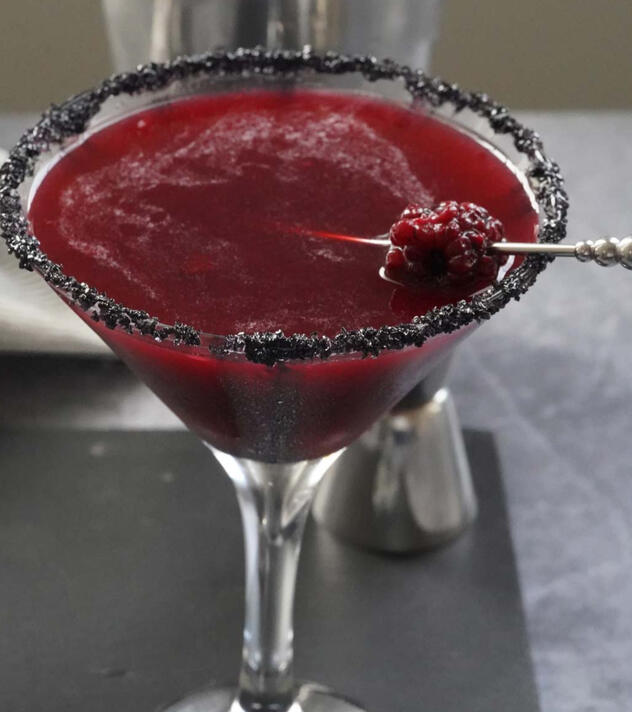 Moonshadow martini Vodka, elderflower, and blackcurrant, shimmering with edible silver melon dust—mysterious and smooth.