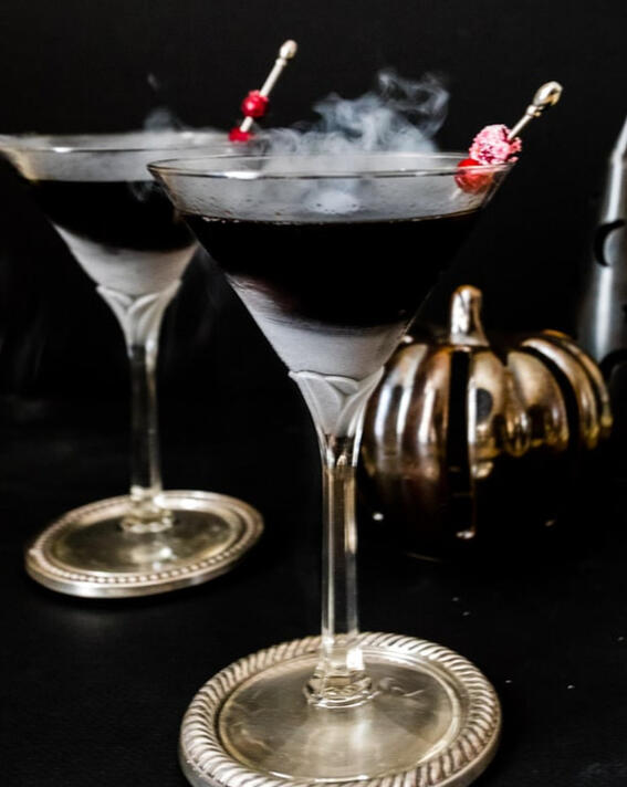 **Black Magic Martini ** Costa del Sol tequila blend of blackberries, dark purple carrots, and a splash of lime, charged with a touch of White Lightning Magic. This luminous elixir shimmers with midnight hues and crackles with energy.